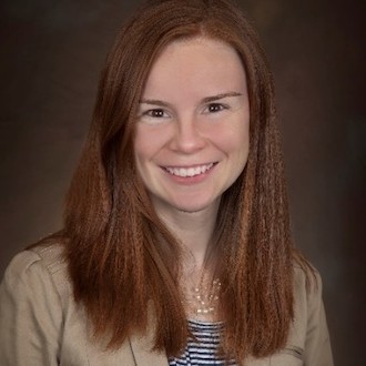 Woman smiling for camera.