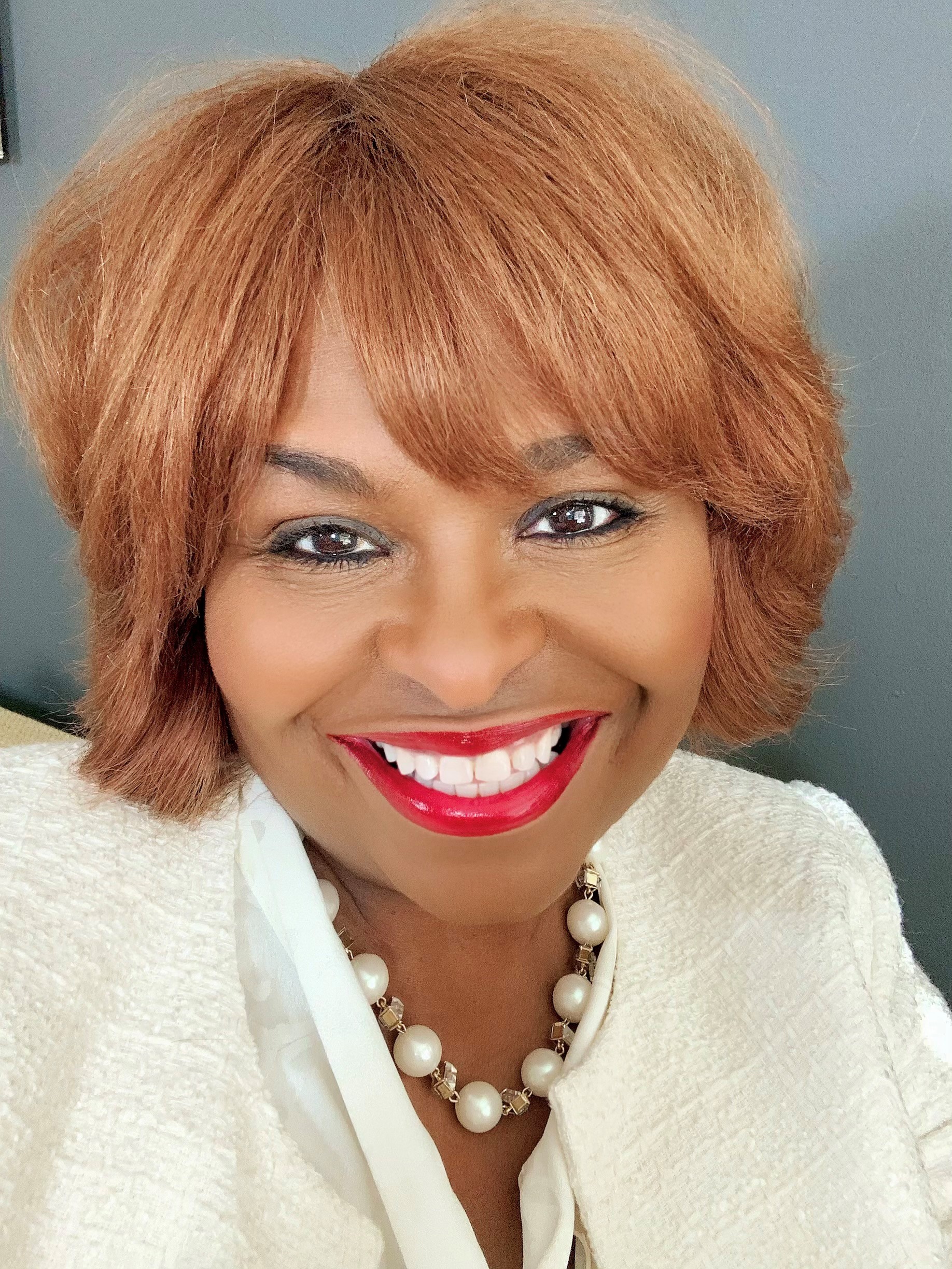 Woman smiling for camera.